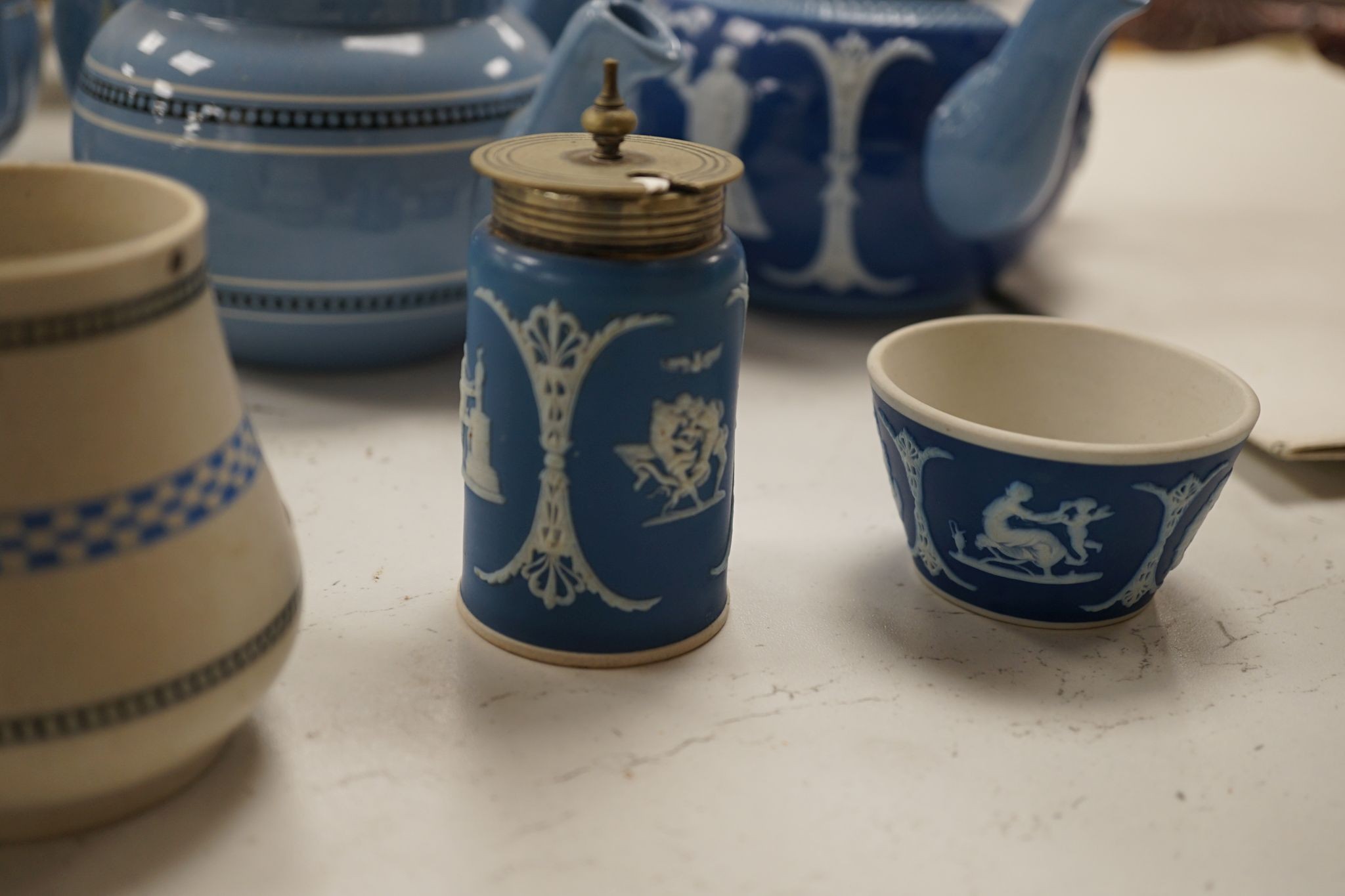 A collection of Dudson stoneware, including jugs, teapots, cream jugs etc, many decorated in low relief